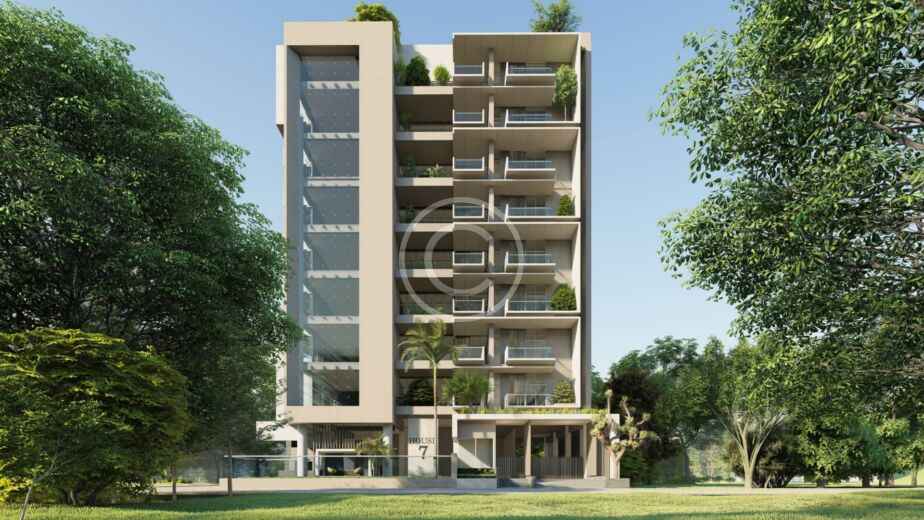 Moderno edificio de apartamentos de mediana altura con grandes balcones y zonas verdes, diseñado a partir de un plano detallado, rodeado de árboles y césped bajo un cielo despejado.